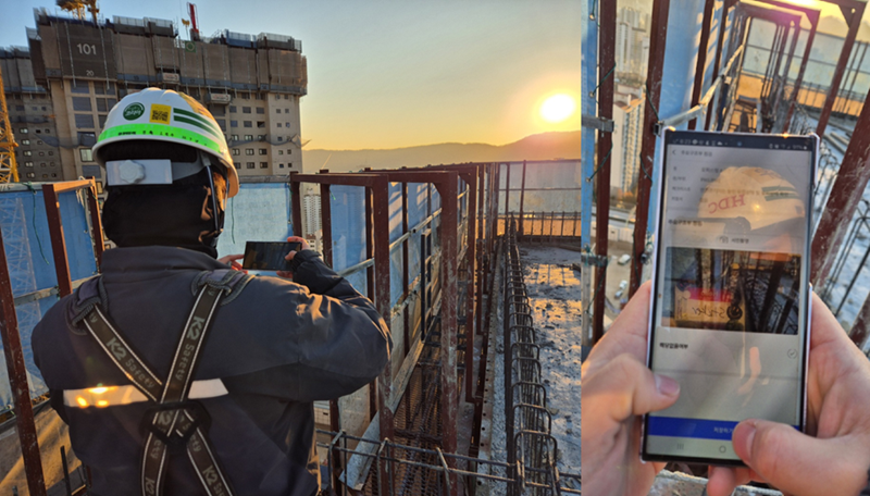 HDC현대산업개발 직원이 건설현장에서 모바일로 I-QMS를 활용해 품질점검을 진행하고 있다. /HDC현대산업개발 제공